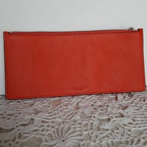 Coach orange pop up pouch/clutch bag